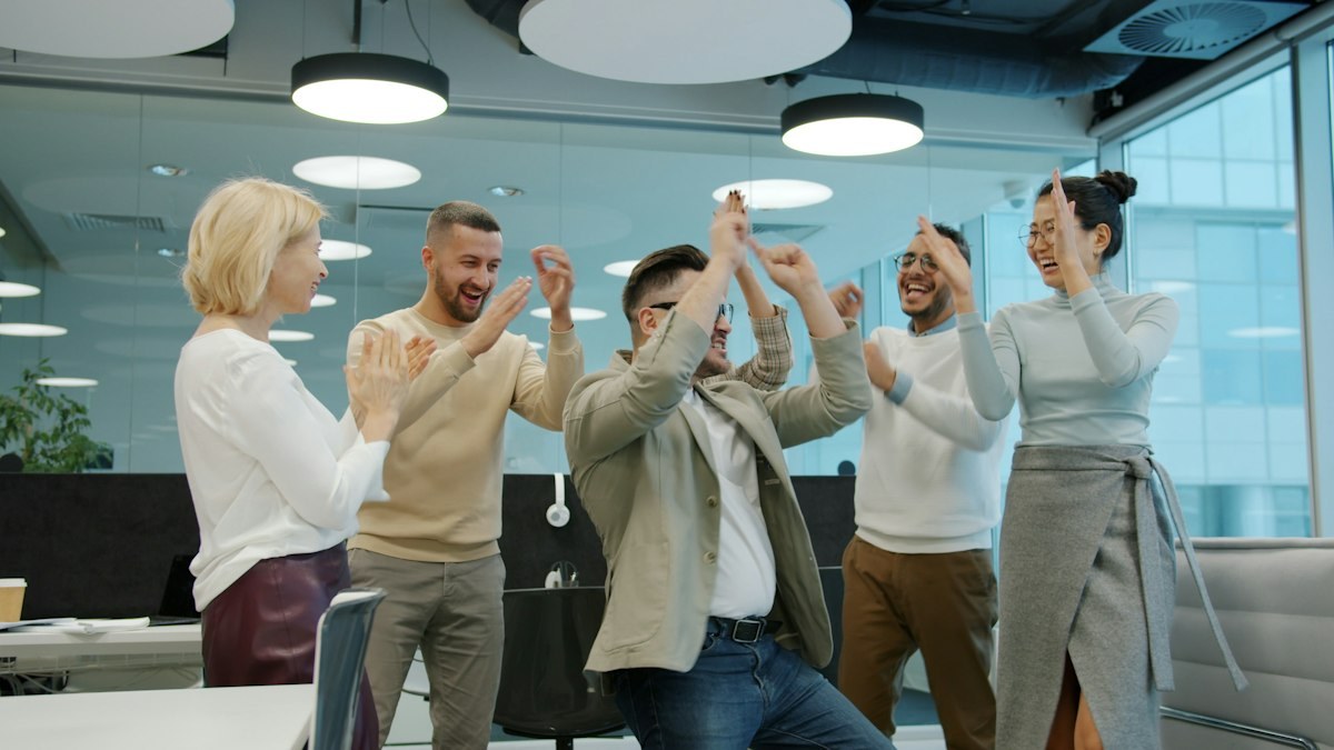 The team cheering together at an office event