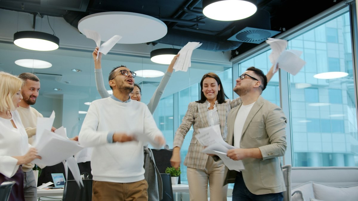 The team celebrating a big win in the office
